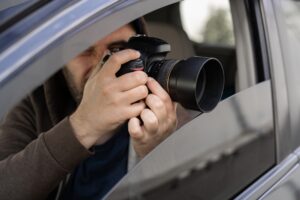 Investigator,Or,Private,Detective,,Reporter,Or,Paparazzi,Sitting,In,Car